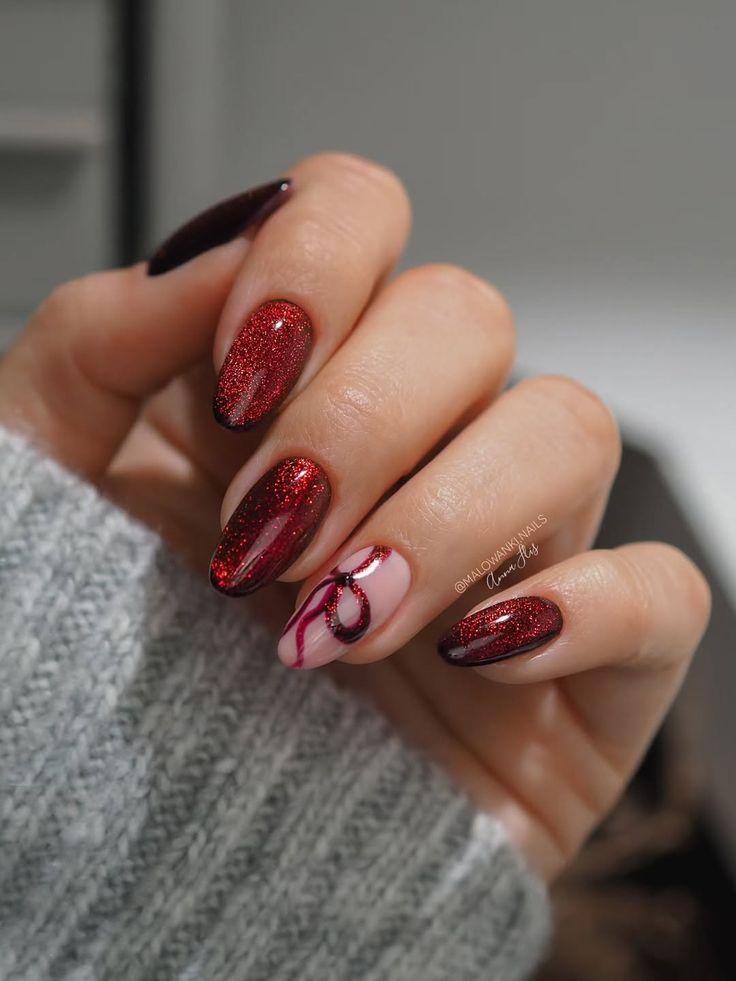 Red glossy nails with glitter accents