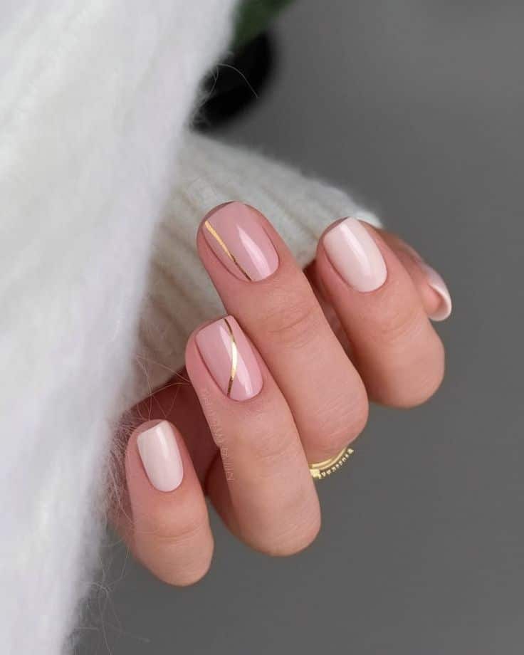 Soft pink nails with gold foil detailing